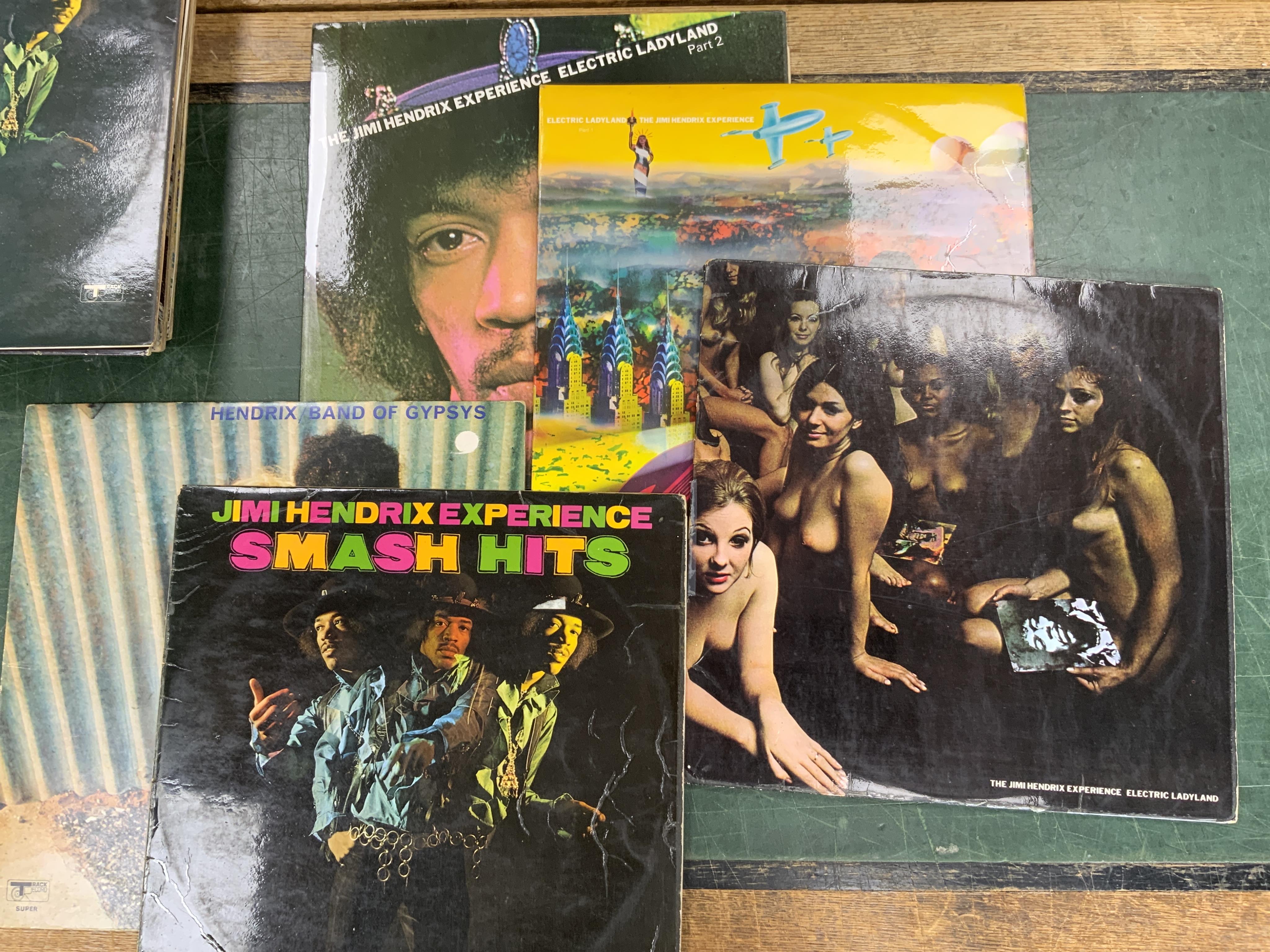 Eighteen Jimi Hendrix LP record albums including; Electric Ladyland, Band of Gypsies, Smash Hits, The Cry of Love, Live Experience, Isle of Wight, etc. plus duplicates. Condition - fair